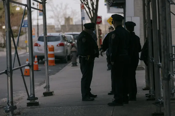 NYPD officers stand outside of the Richmond County Clerk in Staten Island on March 8, 2024.